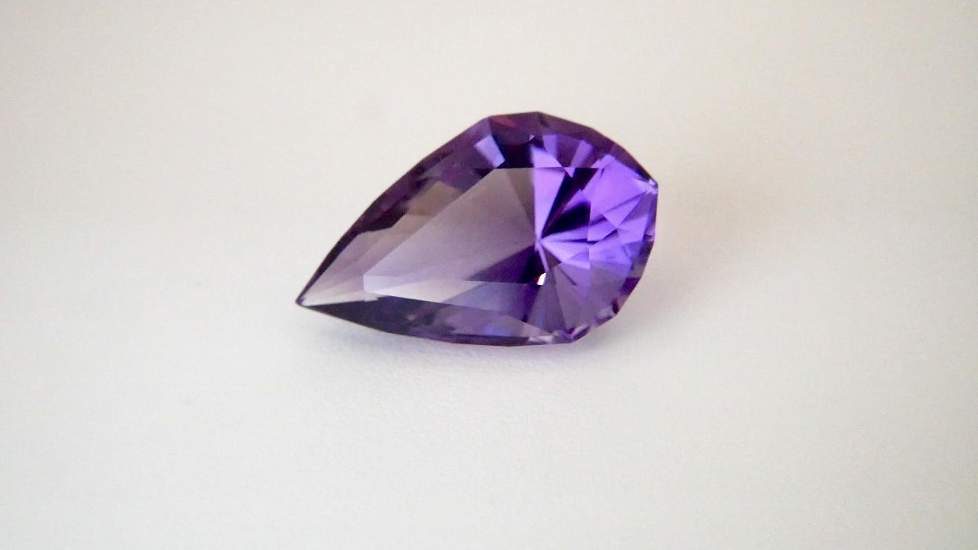 A purple amethyst pear shaped stone